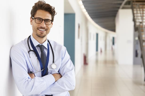 Portrait-of-young-male-doctor-with-stethoscope,-close-up-862722044_5184x3456