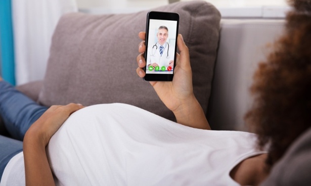 Pregnant-Woman-Video-Conferencing-With-Doctor-On-Smartphone-905726948_1258x839-1-1-1