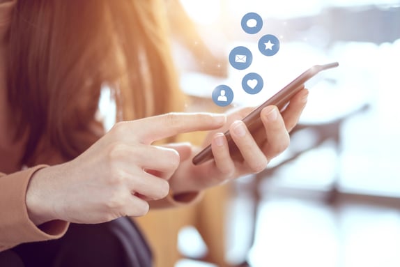 Woman-hands-using-mobile-smartphone-with-icon-social-media-and-social-network.-968719222_1256x838